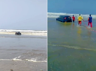 timely rescue saves family stuck in suv on karachi s sea view timely rescue saves family stuck in suv on karachi s sea view