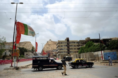 coalition partners begin removal of party flags wall chalking in karachi