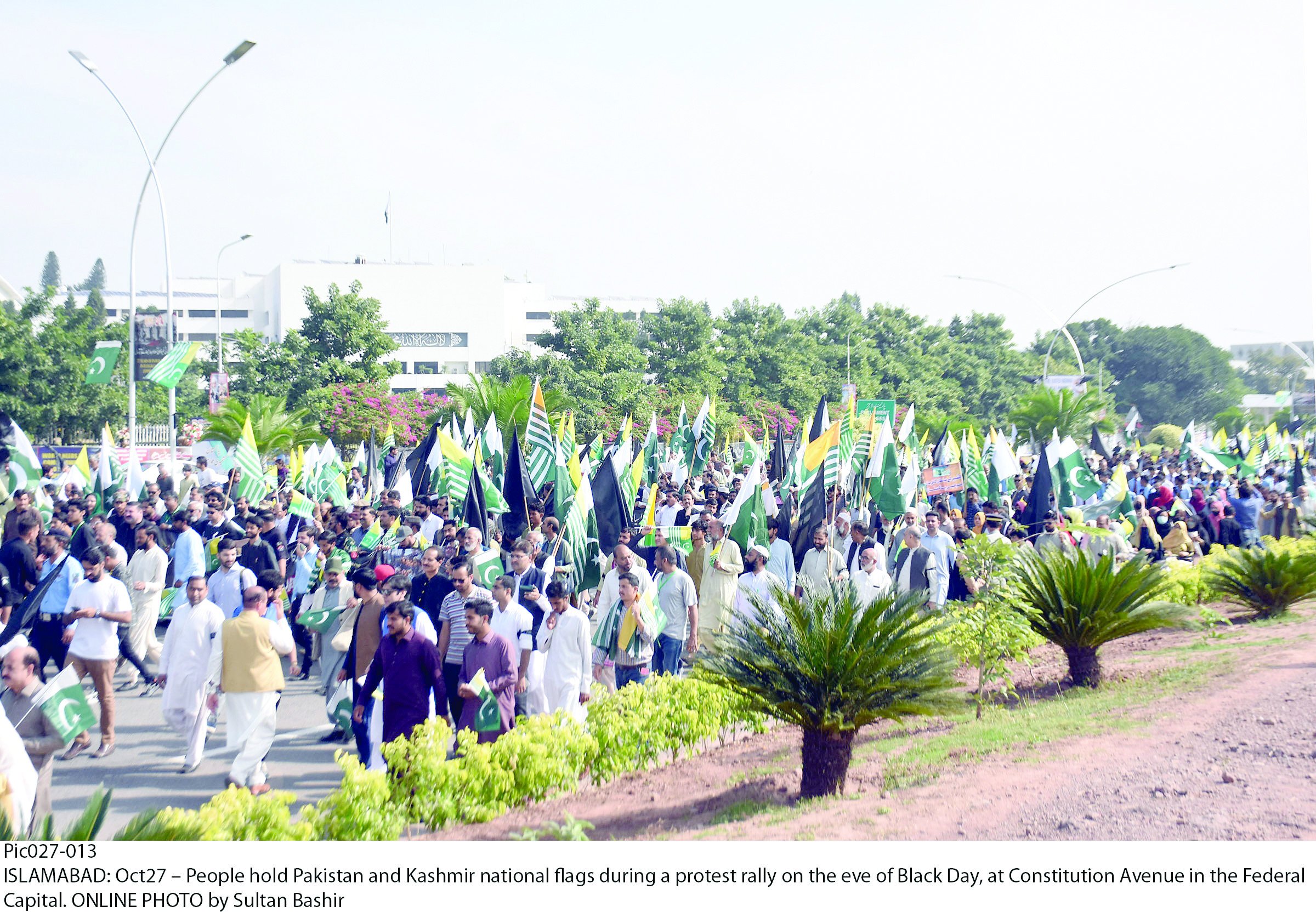 people hold pakistan and kashmir flags during a rally to observe kashmir black day on constitution avenue in islamabad photo online