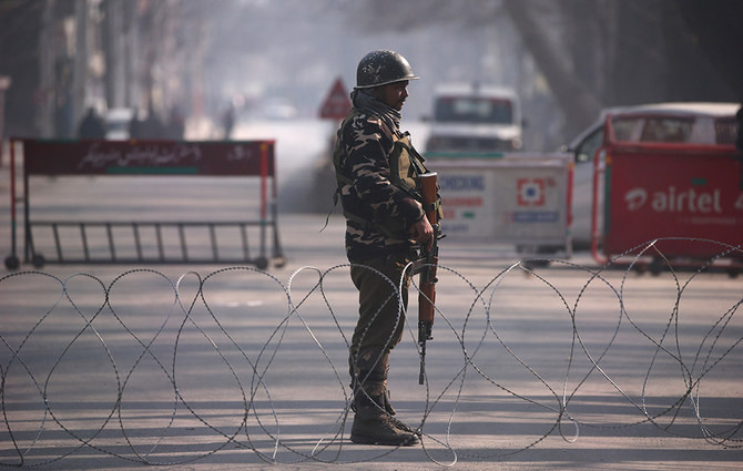 in this file photo an indian paramilitary soldier stands guard in the indian illegally occupied jammu kashmir