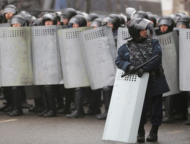 kazakh law enforcement officers block a street during a protest triggered by fuel price increase in almaty kazakhstan january 5 2022 photo reuters