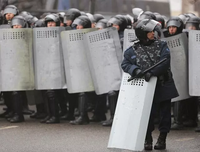kazakh law enforcement officers block a street during a protest triggered by fuel price increase in almaty kazakhstan january 5 2022 photo reuters kazakh law enforcement officers block a street during a protest triggered by fuel price increase in almaty kazakhstan january 5 2022 photo reuters