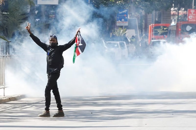 a demonstrator gestures as police use tear gas to disperse protesters in nairobi kenya june 25 photo reuters