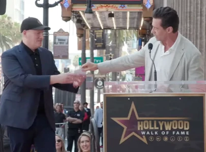 why did hugh jackman give kevin feige 15 steakhouse gift card at his walk of fame ceremony