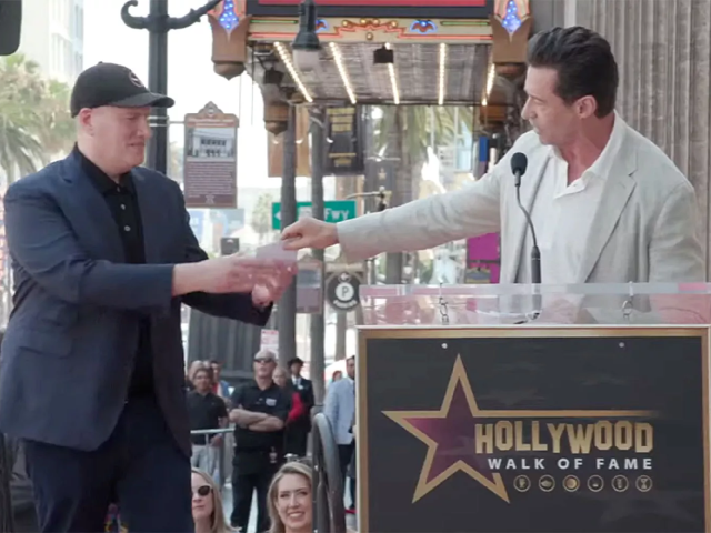 kevin feige accepts a gift card from hugh jackman photo variety youtube