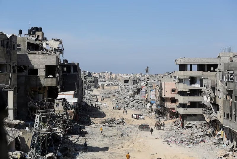 palestinians inspect destroyed residential buildings in khan younis in the southern gaza strip april 7 2024 photo reuters