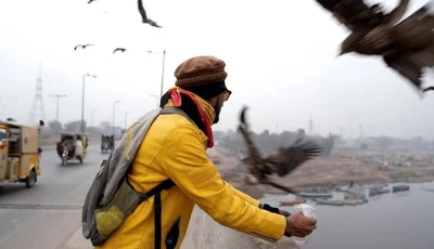 khurram feeds leftover bread to kites along ravi bridge in lahore pakistan january 3 2024 photo reuters