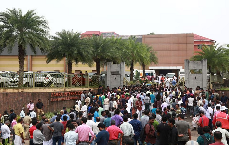 people stand outside a convention centre where multiple blasts occurred during a religious gathering in kochi india october 29 2023 photo reuters