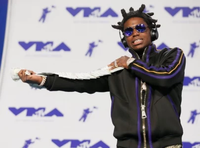 kodak black reunites with childhood babysitter who shares emotional prayer during golden acres community visit kodak black reunites with childhood babysitter who shares emotional prayer during golden acres community visit