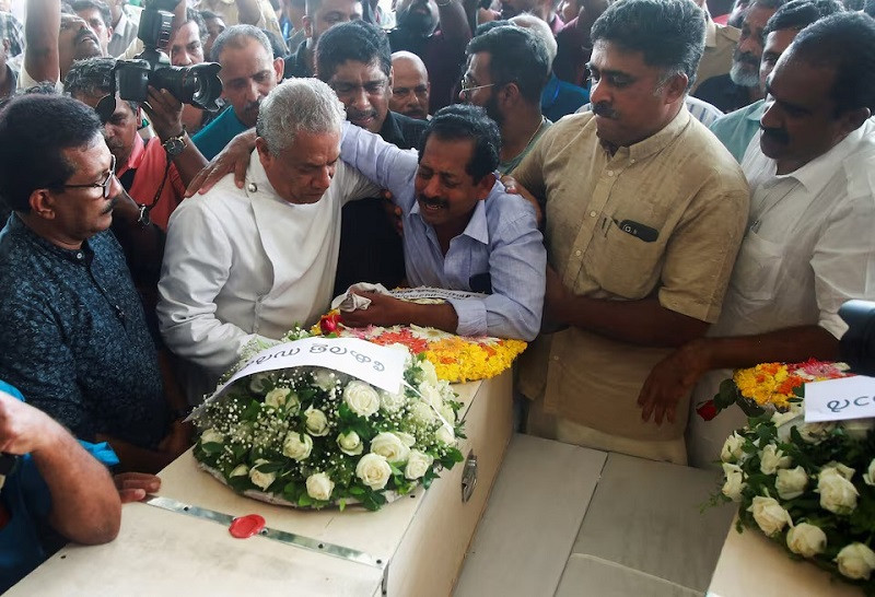 Father of Cibin Thevarottu Abraham, one of the victims of a fire that broke out in a building housing foreign workers in Kuwait, cries next to the coffin containing the body of his son at Cochin International Airport, in Kochi, in the southern Indian state of Kerala, June 14, 2024. PHOTO: REUTERS