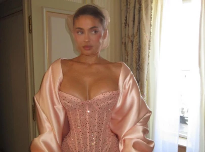kylie jenner dazzles in pink corset dress and face veil at schiaparelli paris fashion week show