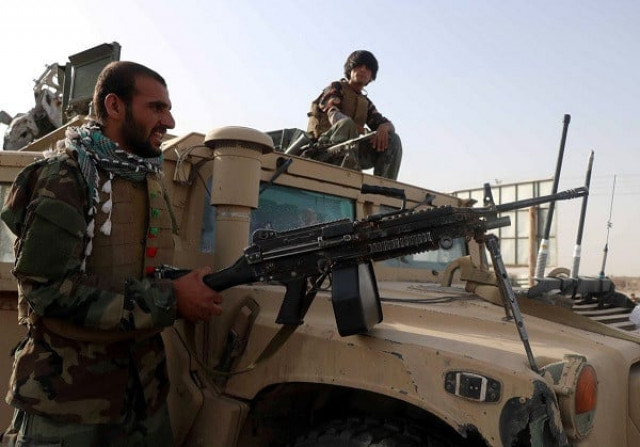afghan national army ana soldiers keep watch at a checkpoint in the guzara district of herat province afghanistan photo reuters