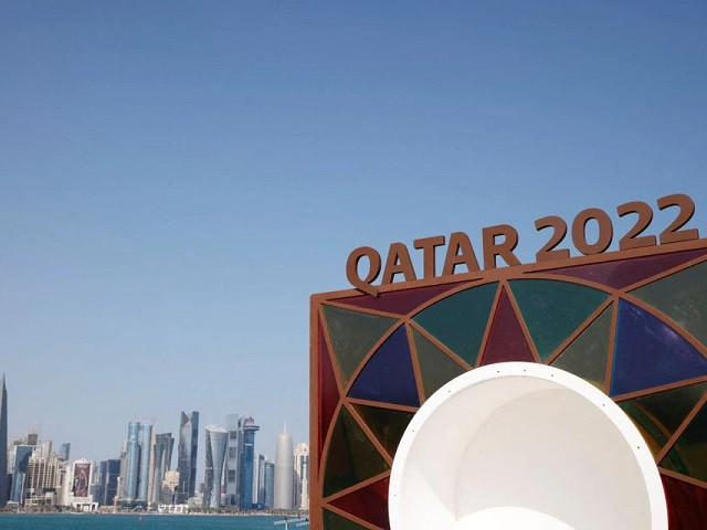 a qatar 2022 logo is seen in front of the skyline of the west bay in doha photo reuters