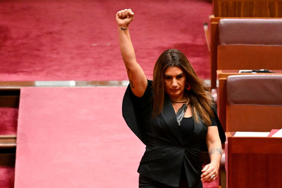 indigenous australian parliamentarian lidia thorpe raises her fist during her swearing in ceremony in the senate chamber at parliament house in canberra australia august 1 2022 reuters