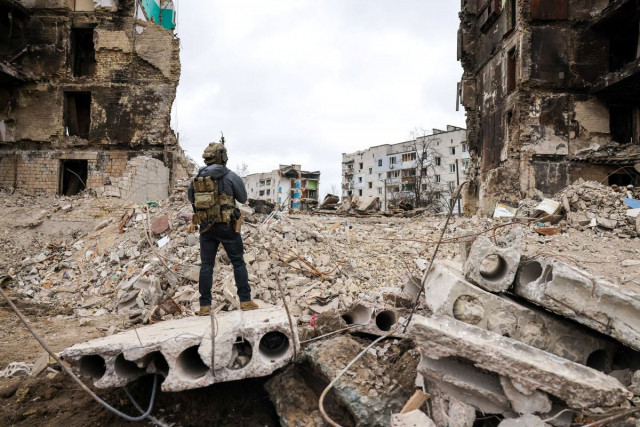 a person stands in front of destroyed buildings during the visit of polish president andrzej duda to borodianka as russia s attack on ukraine continues in the kyiv region ukraine april 13 2022 picture taken april 13 2022 photo reuters a person stands in front of destroyed buildings during the visit of polish president andrzej duda to borodianka as russia s attack on ukraine continues in the kyiv region ukraine april 13 2022 picture taken april 13 2022 photo reuters