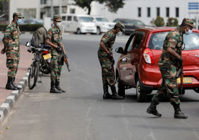 sri lankan army soldiers stand guard at a checkpoint after the government imposed a curfew following a clash between police and protestors near sri lankan president gotabaya rajapaksa s residence during a protest last thusrday amid the country s economic crisis in colombo sri lanka april 3 2022 reuters sri lankan army soldiers stand guard at a checkpoint after the government imposed a curfew following a clash between police and protestors near sri lankan president gotabaya rajapaksa s residence during a protest last thusrday amid the country s economic crisis in colombo sri lanka april 3 2022 reuters