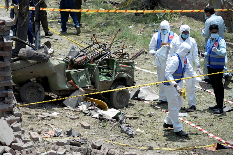 members of the counter terrorism department ctd survey the site after a deadly blast in residential area in lahore pakistan june 23 2021 photo reuters