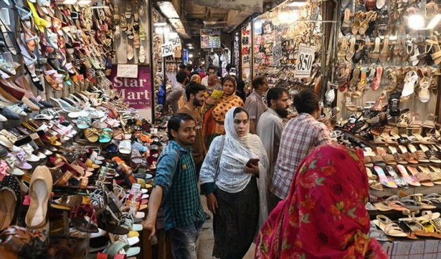 in this picture taken on april 16 2023 people throng a market during shopping ahead of the upcoming festival of eidul fitr photo afp in this picture taken on april 16 2023 people throng a market during shopping ahead of the upcoming festival of eidul fitr photo afp