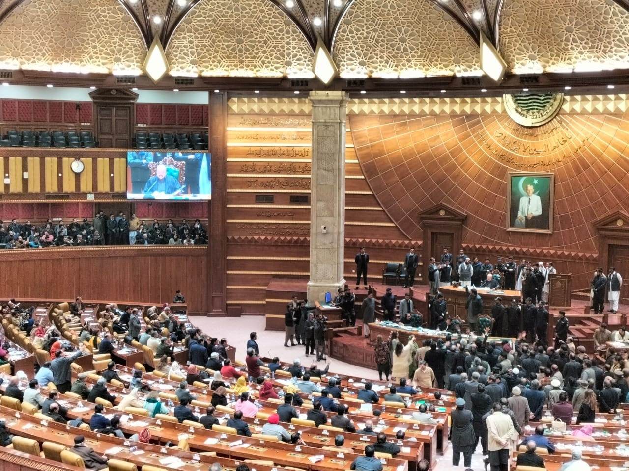 opposition lawmakers surround the speaker s dais during the vote of confidence proceedings photo express