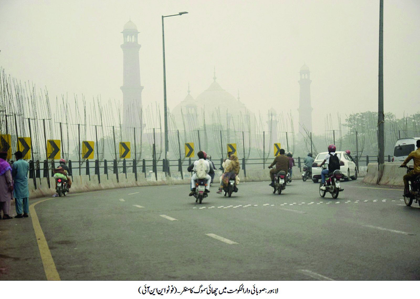 a thick layer of smog dampens the beauty of the iconic badshahi mosque in lahore photo nni