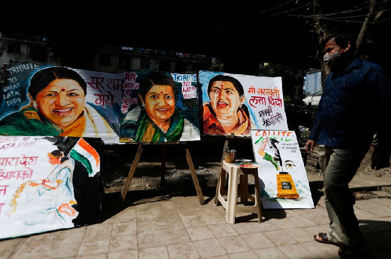 a man walks past a tribute to late indian singer and music composer lata mangeshkar after she passes away in mumbai india february 6 2022 photo reuters