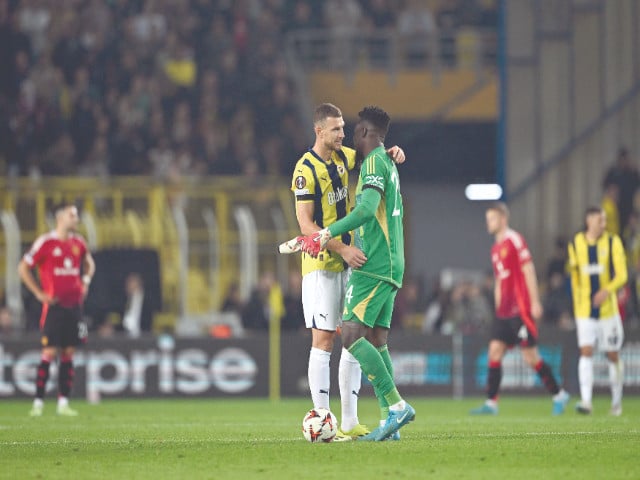 fenerbahce s forward edin dzeko l embraces manchester united goalkeeper andre onana after uefa europa league match in istanbul photo afp