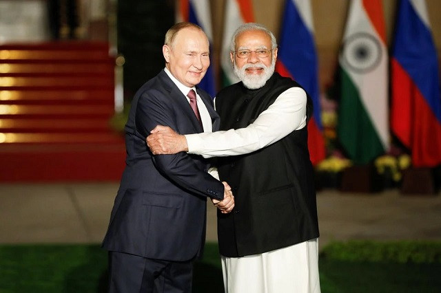 russia s president vladimir putin shakes hands with india s prime minister narendra modi ahead of their meeting at hyderabad house in new delhi india december 6 2021 photo reuters