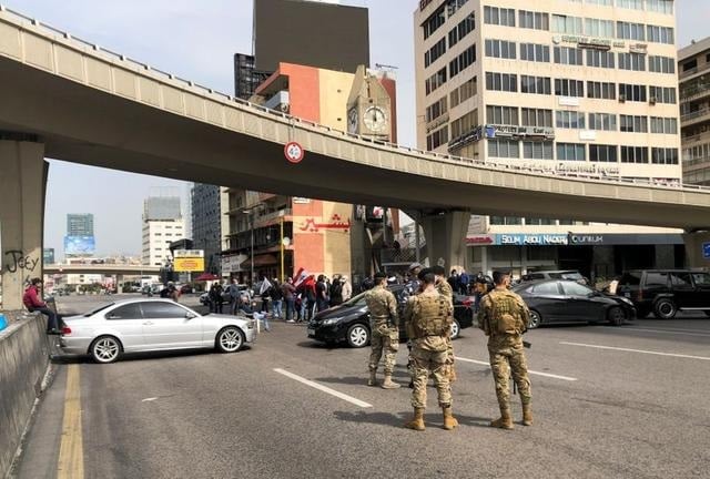 cars block a highway during a protest against the fall in lebanese pound currency and mounting economic hardships in jal el dib lebanon march 9 2021 photo reuters