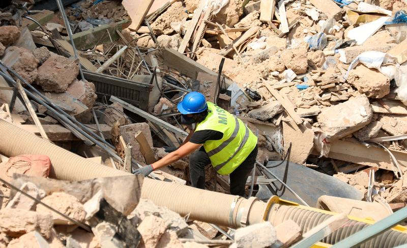 a volunteer digs through the rubble of buildings which collapsed due to the explosion at the port area after signs of life were detected in gemmayze beirut lebanon september 5 2020 photo reuters