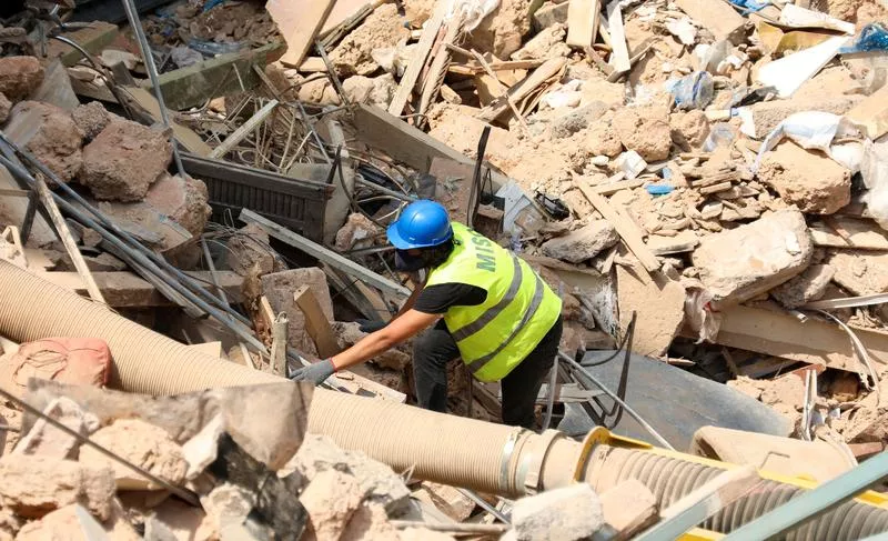 a volunteer digs through the rubble of buildings which collapsed due to the explosion at the port area after signs of life were detected in gemmayze beirut lebanon september 5 2020 photo reuters a volunteer digs through the rubble of buildings which collapsed due to the explosion at the port area after signs of life were detected in gemmayze beirut lebanon september 5 2020 photo reuters