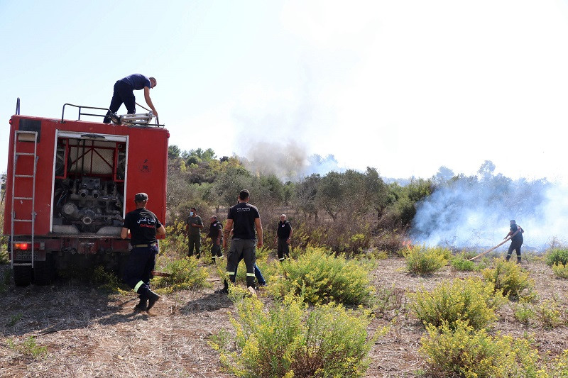 lebanese civil defence volunteers extinguish a forest fire which ignited following shelling from israel in alma al shaab october 26 2023 photo afp