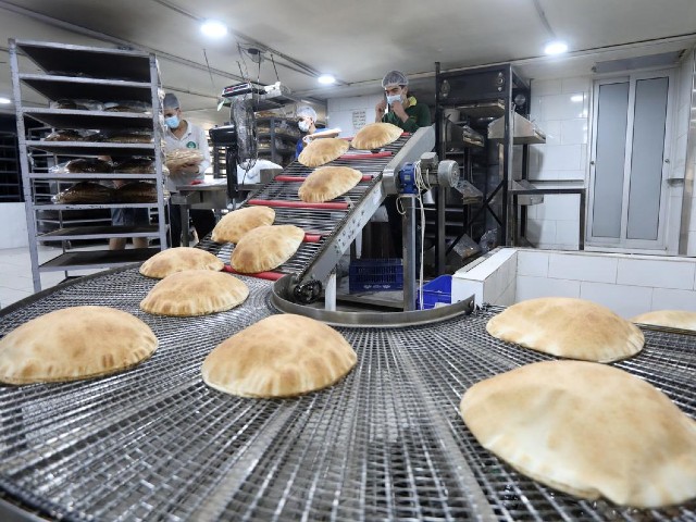 workers pack freshly baked bread at a bakery in beirut following tuesday s blast in beirut s port area lebanon august 5 2020 photo reuters