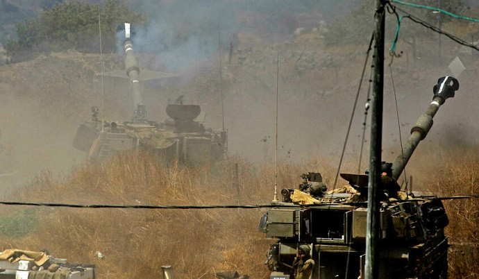 israeli artillery pounds border areas of south lebanon in response to wednesday s rocket fire photo afp