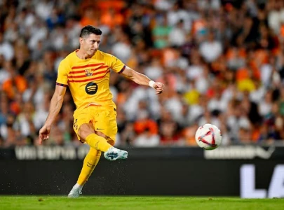 lewandowski leads barcelona to victory in flick s laliga opener