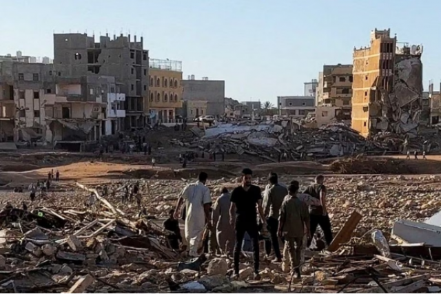 people walk through debris after a powerful storm and heavy rainfall hit libya in derna in this still image from video obtained from social media photo reuters people walk through debris after a powerful storm and heavy rainfall hit libya in derna in this still image from video obtained from social media photo reuters