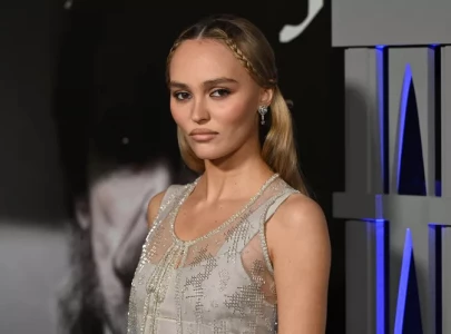 lily rose depp s vampire inspired braid crown at the nosferatu premiere is pure timeless elegance