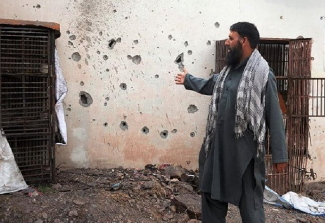 a pakistani kashmiri man points to a damaged wall hit by a mortar during cross border shelling in nakyal sector on the heavily militarised line of control loc in azad kashmir on august 18 2015 afp a pakistani kashmiri man points to a damaged wall hit by a mortar during cross border shelling in nakyal sector on the heavily militarised line of control loc in azad kashmir on august 18 2015 afp