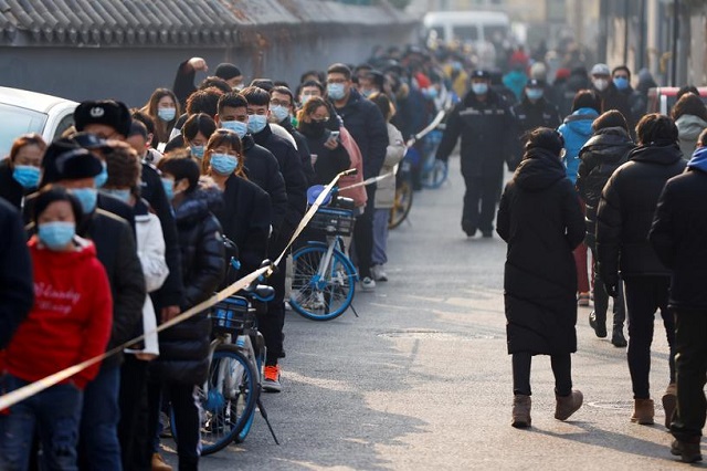 people line up to get their nucleic acid test following the outbreak of the coronavirus disease covid 19 in beijing china january 22 2021 photo reuters