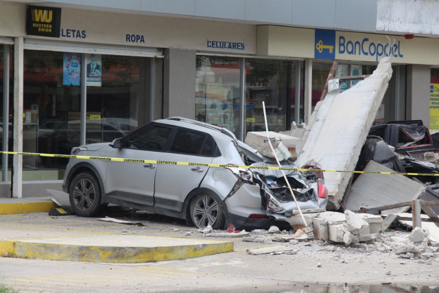 vehicles damaged by the collapse of the facade of a department store during an earthquake in manzanillo mexico photo reuters vehicles damaged by the collapse of the facade of a department store during an earthquake in manzanillo mexico photo reuters