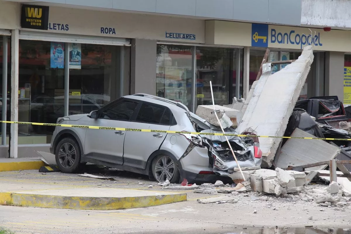 vehicles damaged by the collapse of the facade of a department store during an earthquake in manzanillo mexico photo reuters vehicles damaged by the collapse of the facade of a department store during an earthquake in manzanillo mexico photo reuters