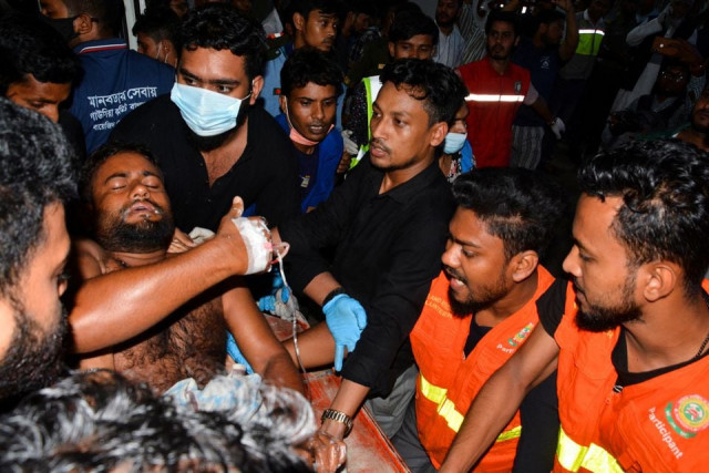 an injured victim is brought to a hospital after a massive fire broke out in an inland container depot at sitakund near the port city chittagong bangladesh june 5 2022 reuters