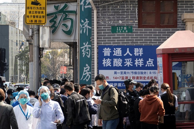 residents line up outside a nucleic acid testing site of a hospital following cases of the coronavirus disease covid 19 in shanghai china march 11 2022 photo reuters