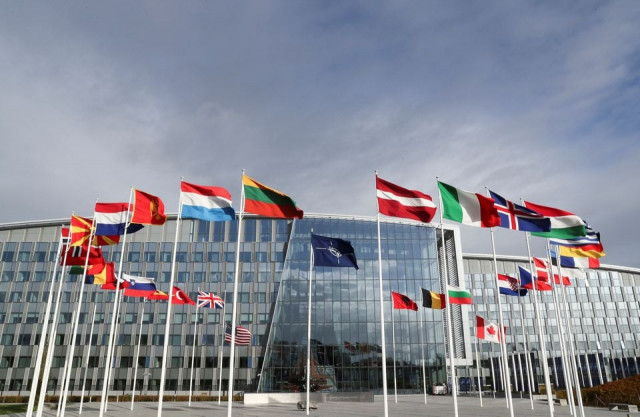 flags wave outside the alliance headquarters ahead of a nato defence ministers meeting in brussels belgium october 21 2021 reuters flags wave outside the alliance headquarters ahead of a nato defence ministers meeting in brussels belgium october 21 2021 reuters
