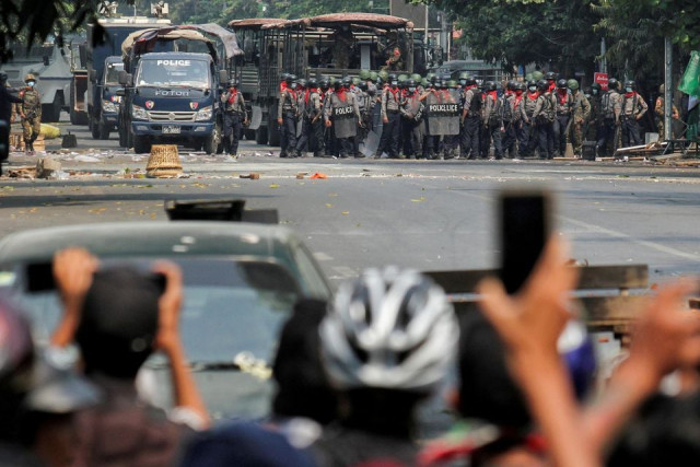 file photo police stand on a road during an anti coup protest in mandalay myanmar march 3 2021 reuters file photo police stand on a road during an anti coup protest in mandalay myanmar march 3 2021 reuters