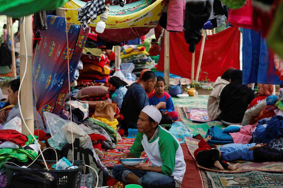 locals are sheltered in a makeshift tent after monday s earthquake hit cianjur west java province indonesia november 24 2022 reuters ajeng dinar ulfiana