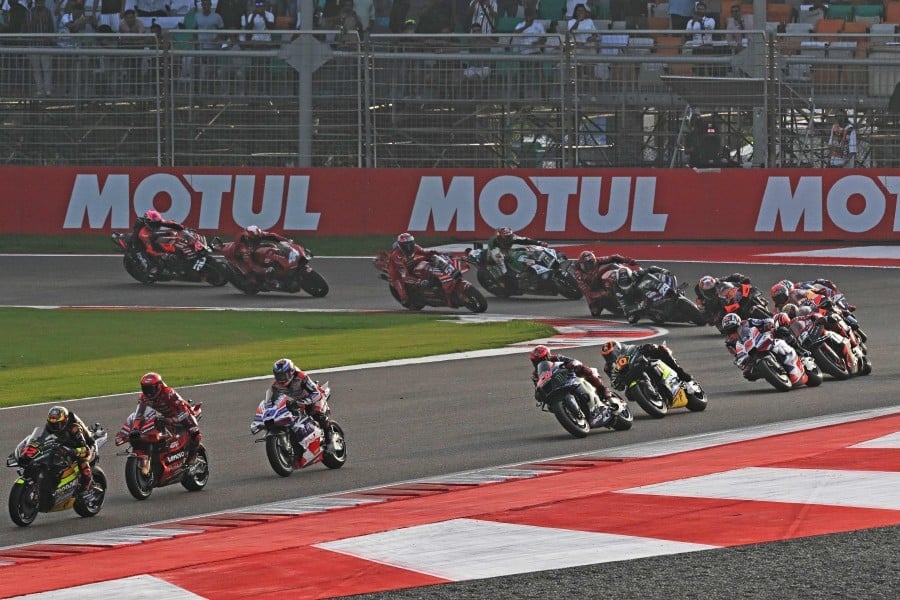 spain s rider maverick vinales l leads the pack during the indian motogp at the buddh international circuit in greater noida on the outskirts of new delhi photo afp