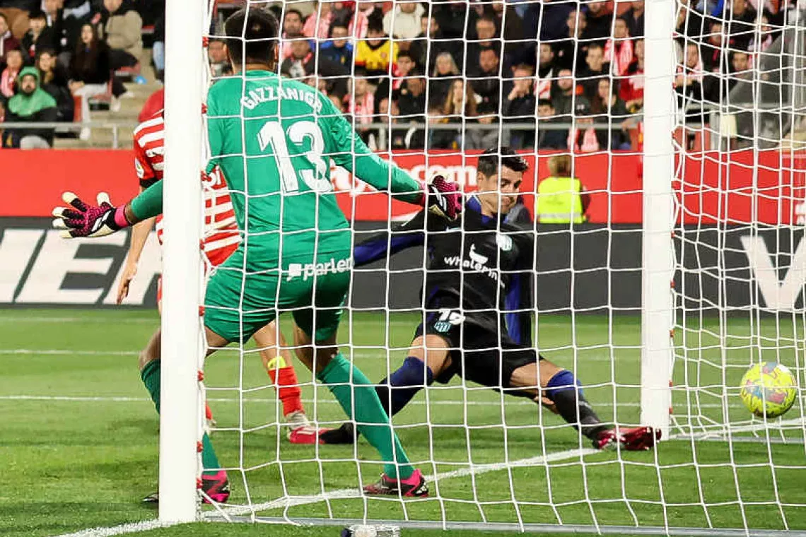 morata strikes late as atletico beat girona morata strikes late as atletico beat girona