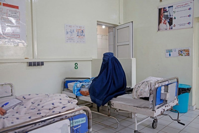 afghan woman basa holds her newborn child at the msf run maternity hospital in khost afghanistan december 8 2023 photo afp afghan woman basa holds her newborn child at the msf run maternity hospital in khost afghanistan december 8 2023 photo afp