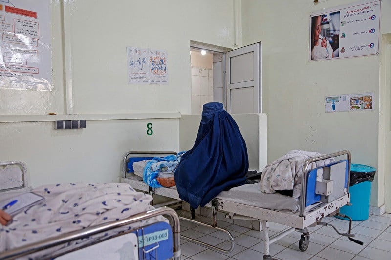 afghan woman basa holds her newborn child at the msf run maternity hospital in khost afghanistan december 8 2023 photo afp