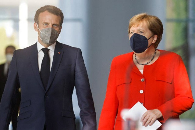 german chancellor angela merkel and french president emmanuel macron arrive to give a news statement in berlin germany june 18 2021 photo reuters